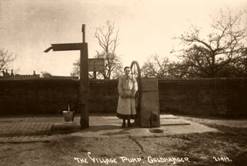 The Square with village pump and girl