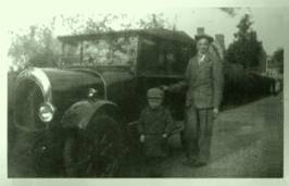 Ernie Barbrook & taxi, with a young Denis Chaplin.jpg